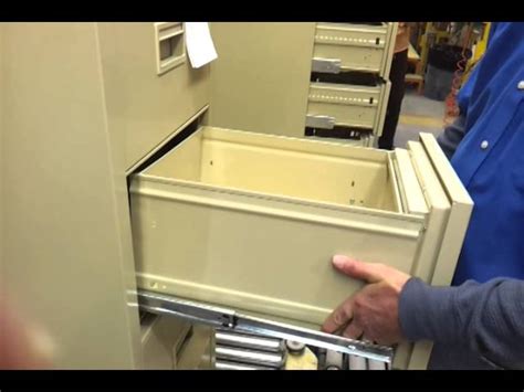 remove drawers from metal file cabinet